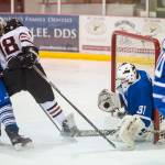 Palmers goalie Tiernan ORourke blocks a point blank shot by Juneau-Douglas Dalton Hoy on Friday, Nov. 16, 2018. (Michael Penn | Juneau Empire