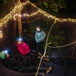 Claire, Gretchyn and Katie settle into the suspended netting. (Gabe Donohoe | For the Juneau Empire)