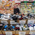 Jim Berry looks through the sock display put out for Black Friday sales at Fred Meyer on Wednesday, Nov. 21, 2018. (Michael Penn | Juneau Empire)