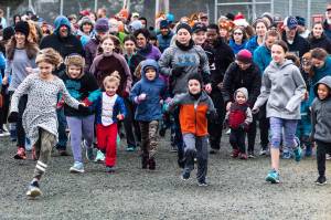 Runners take off from the beginning of the Airport Dike Trail on Thursday for the fifth annual Thanksgiving Day Turkey Trot. Race proceeds went to the Juneau-Douglas High School hockey and Thunder Mountain High School cross country teams. (Courtesy Photo | Scott Spickler)
