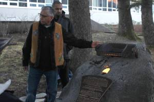 Tlingit elder Paul Marks presents the Sayéik Sacred Site Memorial on Friday, Nov. 23, 2018. The memorial, placed at Sayéik Gastineau Community School, is a tribute to the people who were buried in the Tlingit burial ground that was paved over for the road and school. (Alex McCarthy | Juneau Empire)