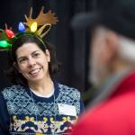 Julie York Coppens, Director of Outreach and Engagement for Perseverance Theatre, mans the theaters booth at the Public Market in the Elizabeth Peratrovich Hall on Friday, Nov. 23, 2018. (Michael Penn | Juneau Empire)