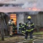 Capital City Fire/Rescue enters the Thane Ore House during a live fire training exercise on Saturday, Nov. 24, 2018. (Nolin Ainsworth | Juneau Empire)
