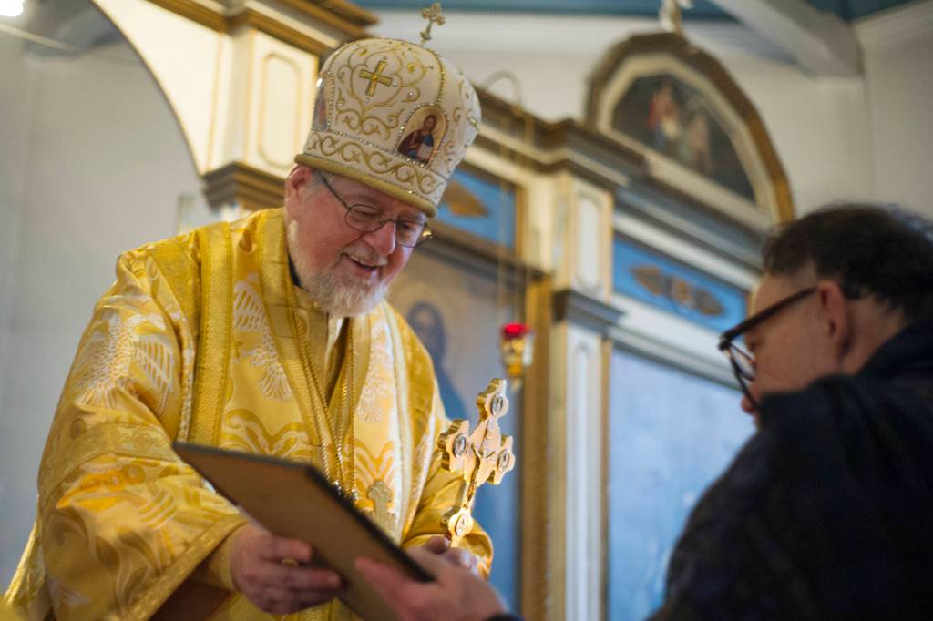 Bishop David, leader of the Russian Orthodox Churchs Diocese of Alaska, presents a certificate of appreciation to Patrick Kearney at the end of Divine Liturgy at St. Nicholas Russian Orthodox Chruch on Sunday, Nov. 25, 2015. (Nolin Ainsworth | Juneau Empire)