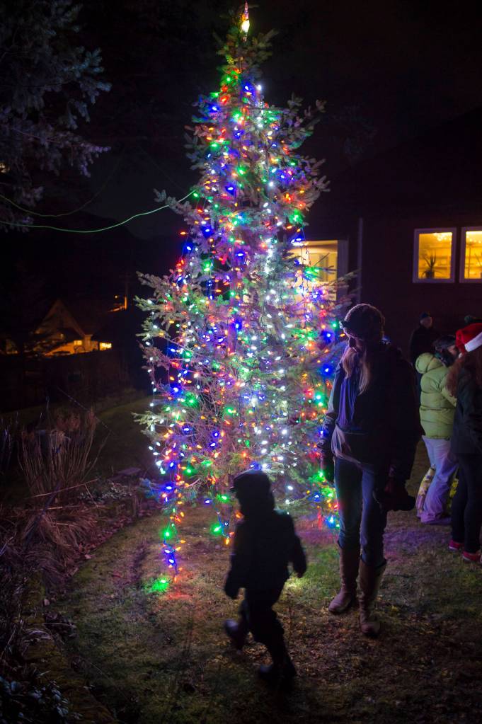 Marysia Szymkowiak and her son, Tadzio Lesh, 20 months, investigate the tree at the annual Douglas Christmas Tree lighting at the Douglas Community United Methodist Church on Friday, Nov. 23, 2018. (Michael Penn | Juneau Empire)