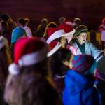 Members of The Voices of Alaska, directed by Missouri Smyth, sing Christmas carols at the annual Douglas Christmas Tree lighting at the Douglas Community United Methodist Church on Friday, Nov. 23, 2018. (Michael Penn | Juneau Empire)
