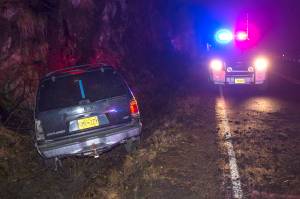 A vehicle sits in a ditch along Thane Road after the driver fell asleep on Tuesday, Nov. 27, 2018. The driver was taken to Bartlett Regional Hospital. (Michael Penn | Juneau Empire)