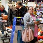 Black Friday shoppers wait in line to check out at the Nebraska Furniture Mart store in Omaha, Nebraska on Friday, Nov. 23, 2018. (Nati Harnik | Associated Press)