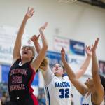 Juneau-Douglas Caitlin Pusich, left, shoots under the basket against Thunder Mountains Nina Fenumiai, center, and Kyra Jenkins-Hayes during their game at TMHS on Friday, Jan. 5, 2017. JDHS won 53-33. (Michael Penn | Juneau Empire File)