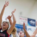 Juneau-Douglas Caitlin Pusich, left, shoots under the basket against Thunder Mountains Nina Fenumiai, center, and Kyra Jenkins-Hayes during their game at TMHS on Friday, Jan. 5, 2017. JDHS won 53-33. (Michael Penn | Juneau Empire File)
