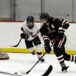 Juneau-Douglas Cameron Smith skates up the ice against Houston during the Big Lake Lions Christmas Classic Tournament last December in the Big Lake Lions Recreation Center. Houston plays JDHS this Friday and Saturday at Treadwell Arena. (Courtesy Photo | MatSuSports.net)