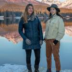 Dec. 16, 2018: On a cold December afternoon, Dana Herndon and Serena Drazkowski stopped by Auke Lake to catch the sunset. Dana was wearing a navy puff jacket from The North Face, black pants, UGG boots, Boheme texting gloves and a mink neck ruff. Serena stayed warm in brown corduroy overalls and white corduroy jacket, topped off by a gray Pendleton wool hat and black Bueno boots from Shoefly.