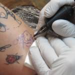 Genevieve McLaughlin received a bumblebee tattoo from Taku Tattoo owner Mario Singh Friday, Nov. 30. McLaughlin said the bee represented community and personal power. (Ben Hohenstatt | Capital City Weekly)