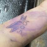 Theresa Hichman and her daughter, Erica Ranney who was visiting from Prince of Wales each got matching butterfly tattoos that incorporated semicolons. They were pleased with the work of Salty Jack Reed Jr., who did their matching tattoos. (Ben Hohenstatt | Capital City Weekly)