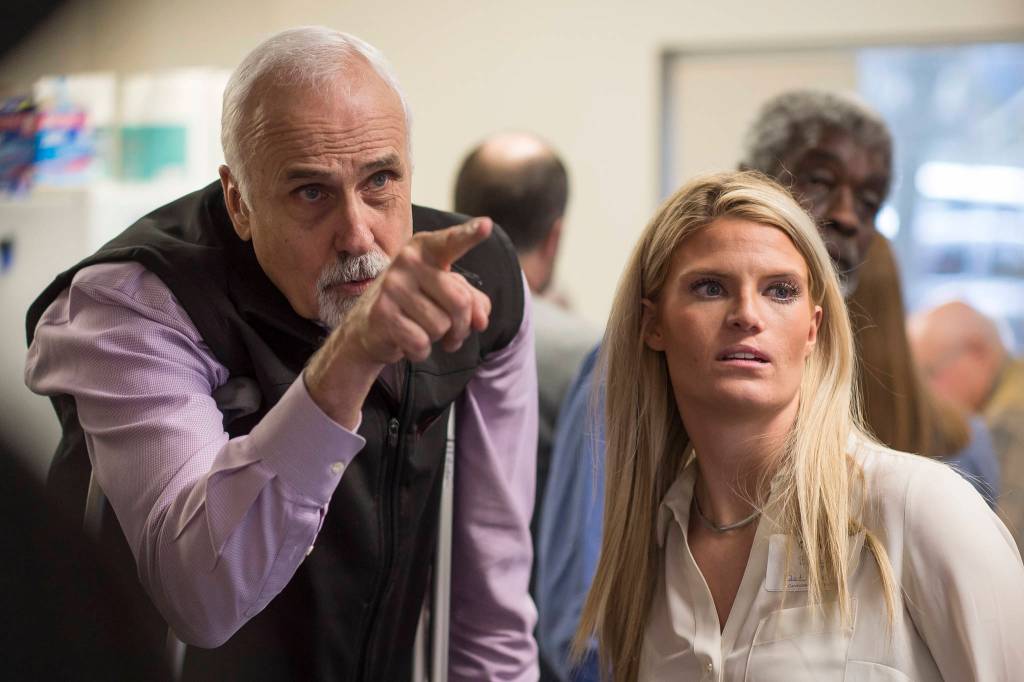House District 1 candidate Republican Bart LeBon points to a vote tally board with his campaign manager Brittany Hartmann during a election recount at the Department of Elections Juneau office on Friday, Nov. 30, 2018. Republican Bart LeBon picked up two votes while Democrat Kathryn Dodge picked up one making him the winner of the election with a total of 2,663 votes. (Michael Penn | Juneau Empire)