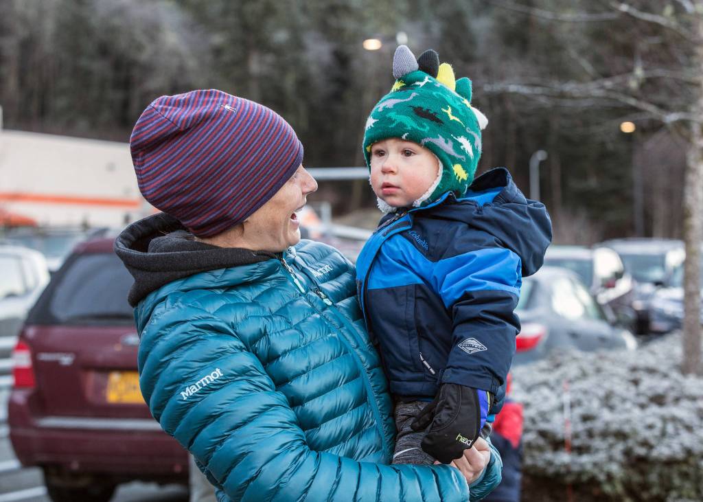 Elise and Bryce Blasco wait for Santa Claus to arrive at Home Depot in Juneau on board a helicopter on Saturday, Dec. 1, 2018. (Courtesy Photo | Heather Holt)
