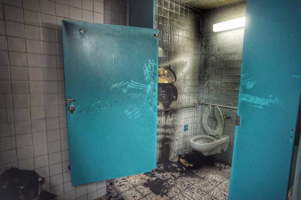 Smoke and fire damage in the mens bathroom at the Mendenhall Mall on Wednesday, Dec. 5, 2018. (Michael Penn | Juneau Empire)