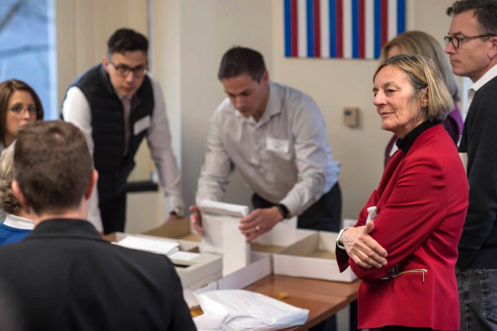 In this Nov. 30, 2018 photo, Alaska House District 1 candidate Democrat Kathryn Dodge, right, watches the election recount at the Department of Elections Juneau, Alaska office. The Democrat who lost a recount by one vote in a contested Alaska House race must decide by Wednesday whether to challenge the results. Kathryn Dodge, in a statement late Tuesday, Dec. 4, 2018, says she and her team were reviewing decisions made by the Division of Elections. She says she disagrees with some of the decisions but wants to look at everything before making a final decision. (Michael Penn | Juneau Empire)
