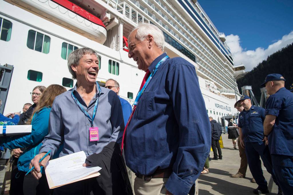 President of CLIA Alaska John Binkley (left) and former Juneau Mayor Ken Koelsch talk as Juneau residents tour the Norwegian Bliss after Plaque Presentations on Tuesday, June 12, 2018. (Michael Penn | Juneau Empire File)