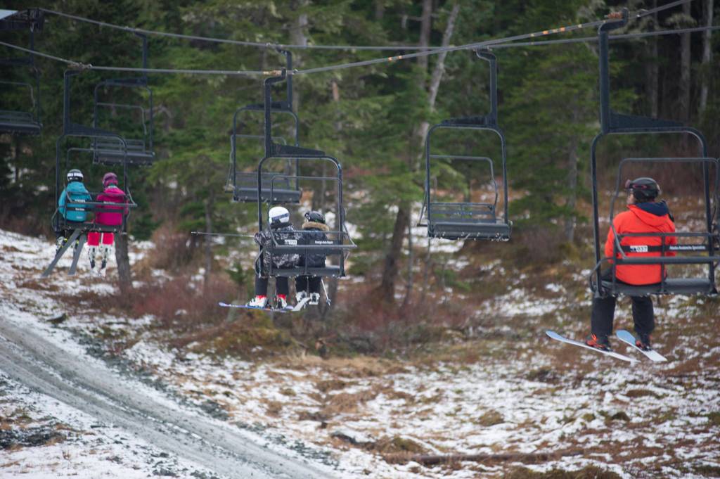Skiers ride up the Porcupine Chairlift on Saturday, Dec. 8, 2018. (Nolin Ainsworth | Juneau Empire)