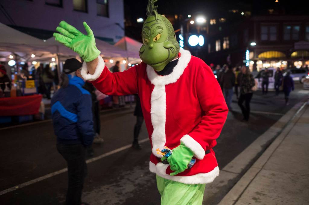 The Grinch makes his appearance on Front Street during Gallery Walk on Friday, Dec. 7, 2018. (Michael Penn | Juneau Empire)