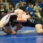 Juneau-Douglas Camden Erickson (bottom) wrestles Ketchikans Brandon Wieber during their 189-pound finals match in the Region V Division I Wrestling Championships at TMHS on Saturday, Dec. 8, 2018. Wieber earned a 9-3 decision to win the region title. (Nolin Ainsworth | Juneau Empire)