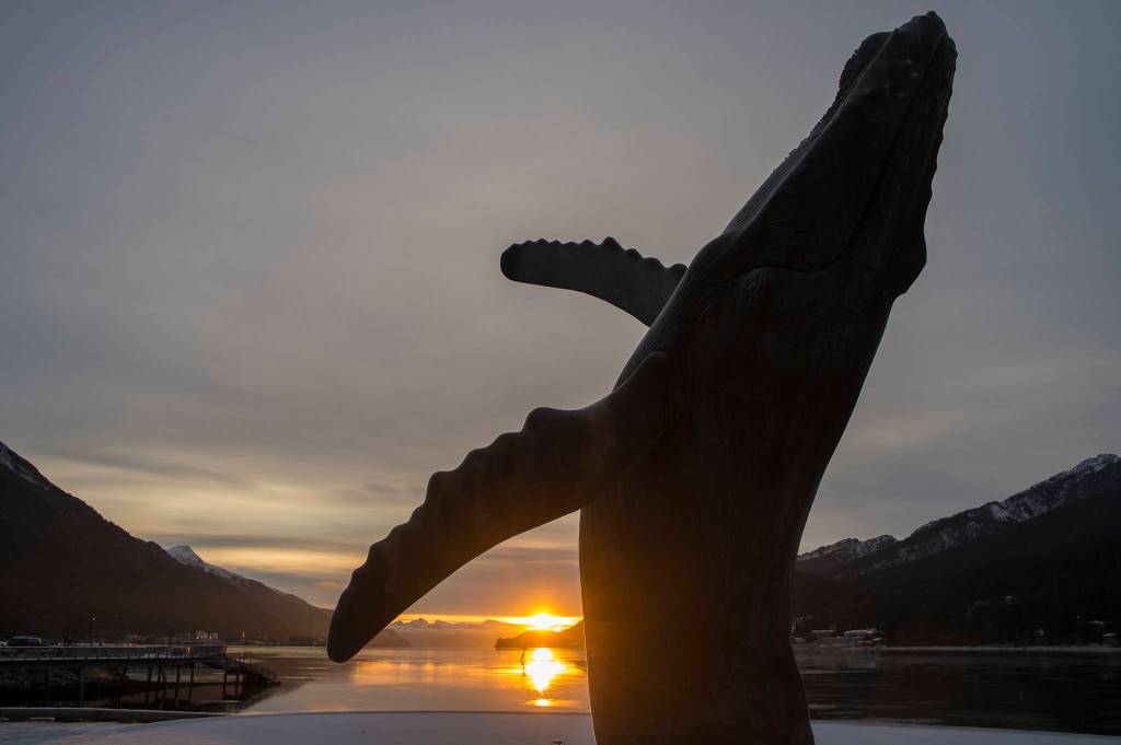 The sun rises above Gastineau Channel as seen from Mayor Bill Overstreet Park on Monday, Dec. 3, 2018. (Michael Penn | Juneau Empire)
