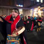 Alfie Price dances with the multicultural dance group Yees Ku Oo on Front Street during Gallery Walk on Friday, Dec. 7, 2018. (Michael Penn | Juneau Empire)