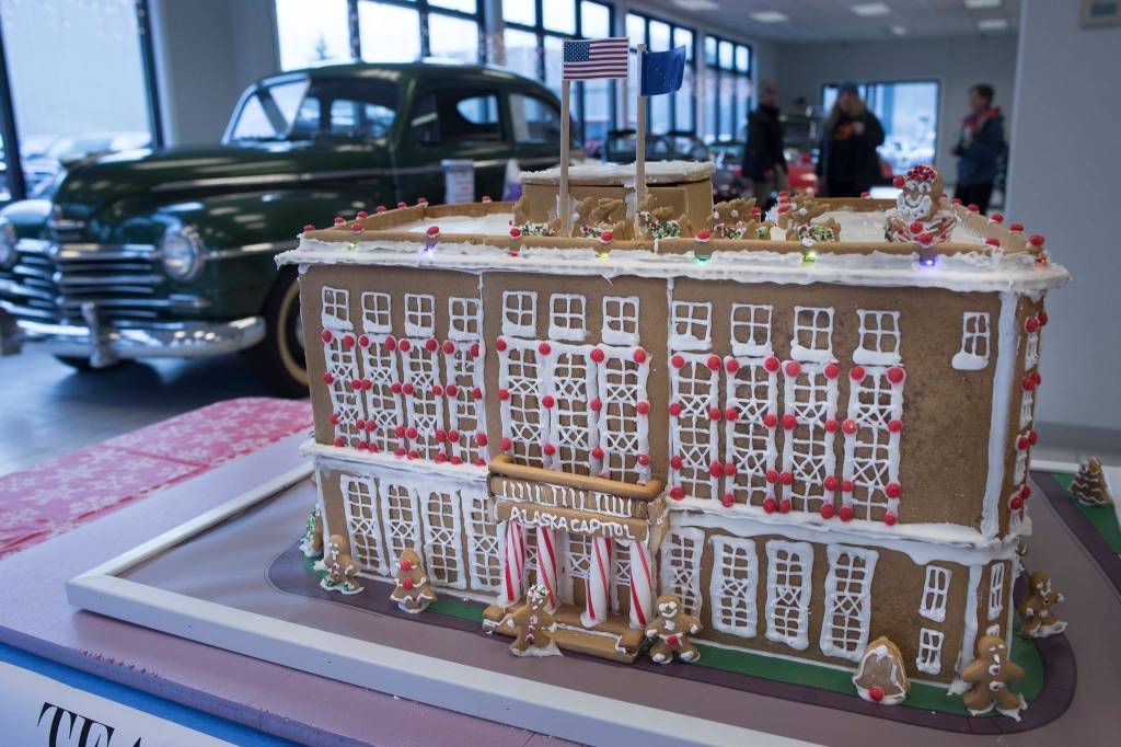 A gingerbread house representation of the Alaska State Capitol entered by Jensen Yorba Lott, Inc. sits on display at Mendenhall Auto on Wednesday, Dec. 12, 2018. The displays are a fundraiser for the Southeast Alaska Foodbank. (Michael Penn | Juneau Empire)