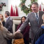 Gov. Mike Dunleavy and his wife, Rose, welcome Juneau residents at the Governors Open House on Tuesday, Dec. 11, 2018. (Michael Penn | Juneau Empire)