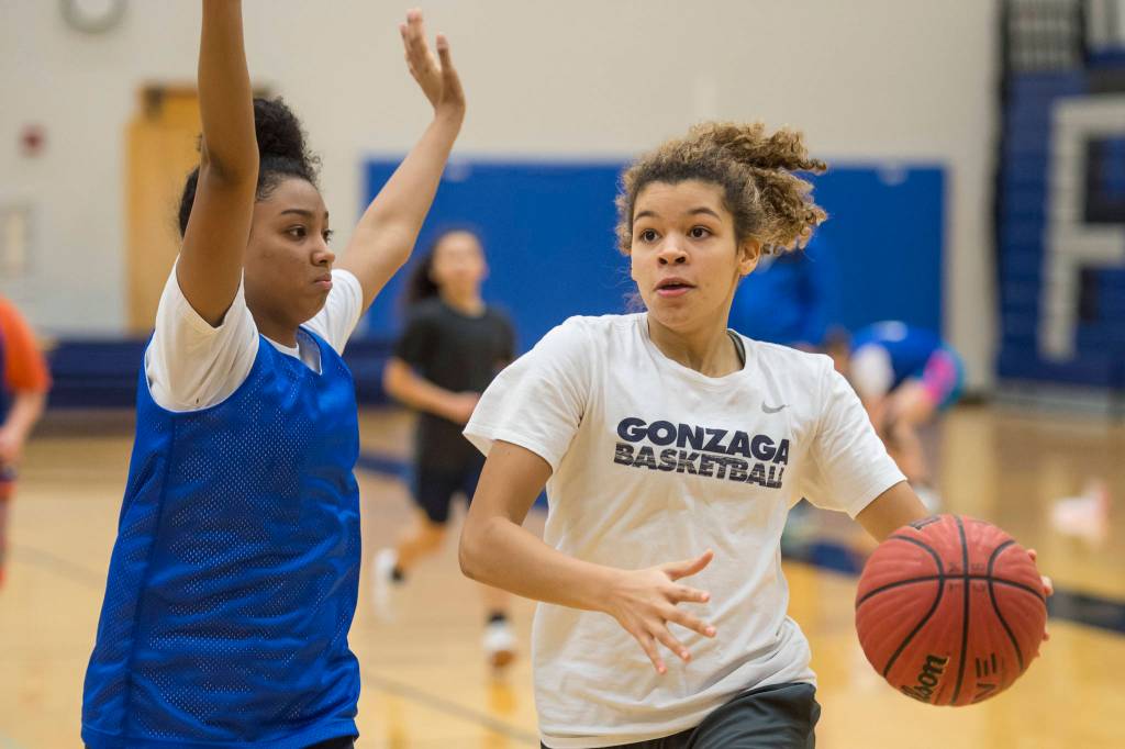 Taz Hauck, right, drives against teammate Iayanah Brewer during early morning girls basketball practice at Thunder Mountain High School on Tuesday, Dec. 11, 2018. (Michael Penn | Juneau Empire)
