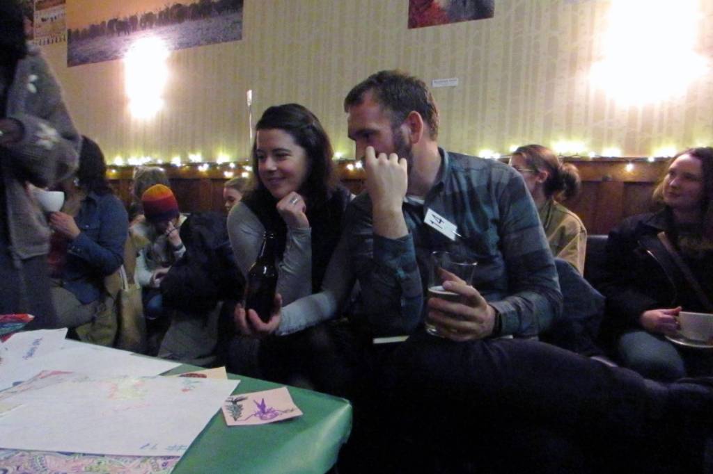 Jesse Peterson and Stephanie Warpinski look at artwork Peterson made during previous Mountainside Open Mics during the final open mic of the season, Thursday, Dec. 13, 2018.