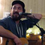 Daniel Firmin performs a song by Fairbanks artist Brandon Reid during his two-song set at the final Mountainside Open Mic of the series first season. (Ben Hohenstatt | Capital City Weekly)