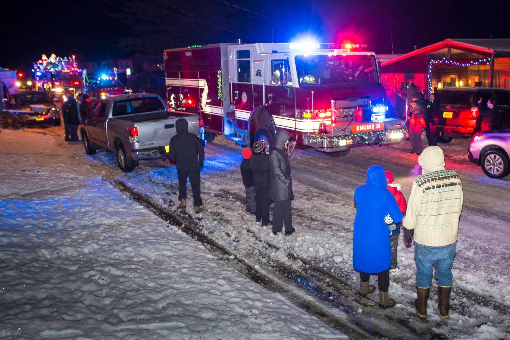The annual Capital City Fire/Rescue Santa Parade makes its way along 2nd Street in Douglas on Friday, Dec. 14, 2018. (Michael Penn | Juneau Empire)