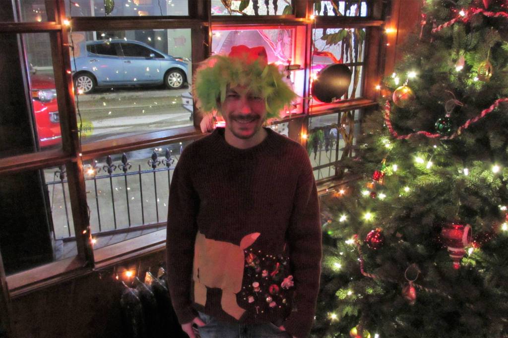 Wes Youngs sweater was among the oddest if not the ugliest at the Alaskan Hotel and Bars ugly Christmas sweater and clothing drive Saturday, Dec. 15, 2018.(Ben Hohenstatt | Capital City Weekly)
