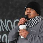 Manni Guillen, whose family moved to Juneau from Mexico when he was a baby, speaks at the Love Knows No Borders rally in Juneau on Saturday, Dec. 15, 2018. Guillen spoke about his experiences growing up in Juneau and working with the Border Angels nonprofit. (Alex McCarthy | Juneau Empire)