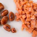 Erin Anais Heist prepares her tomato-based Portuguese fishermans stew with a variety of seafood, spicy sausage, potatoes and smoked paprika in her home kitchen on Friday, Dec. 14, 2018. (Michael Penn | Juneau Empire)