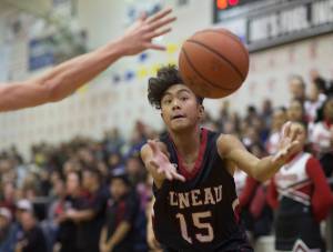 Juneau-Douglas Israel Yadao grabs a loose ball against Palmer during their Capital City Classic Basketball Tournament game at JDHS on Saturday, Dec. 30, 2017. (Michael Penn | Juneau Empire File)
