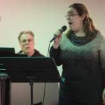 Juneau Cabaret singer Kristina Paulick sings for Juneau residents as she is accompanied by Tom Locher during the third annual Holiday Extravaganza at Centennial Hall on Wednesday, Dec. 19, 2018. (Michael Penn | Juneau Empire)