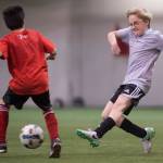 Missile Toes play against the Futbolistas at the Holiday Cup Soccer Tournament in the Dimond Park Field House on Friday, Dec. 22, 2017. The Holiday Cup is underway again now through New Years Eve with 400 players on 30 different teams. (Michael Penn | Juneau Empire File)