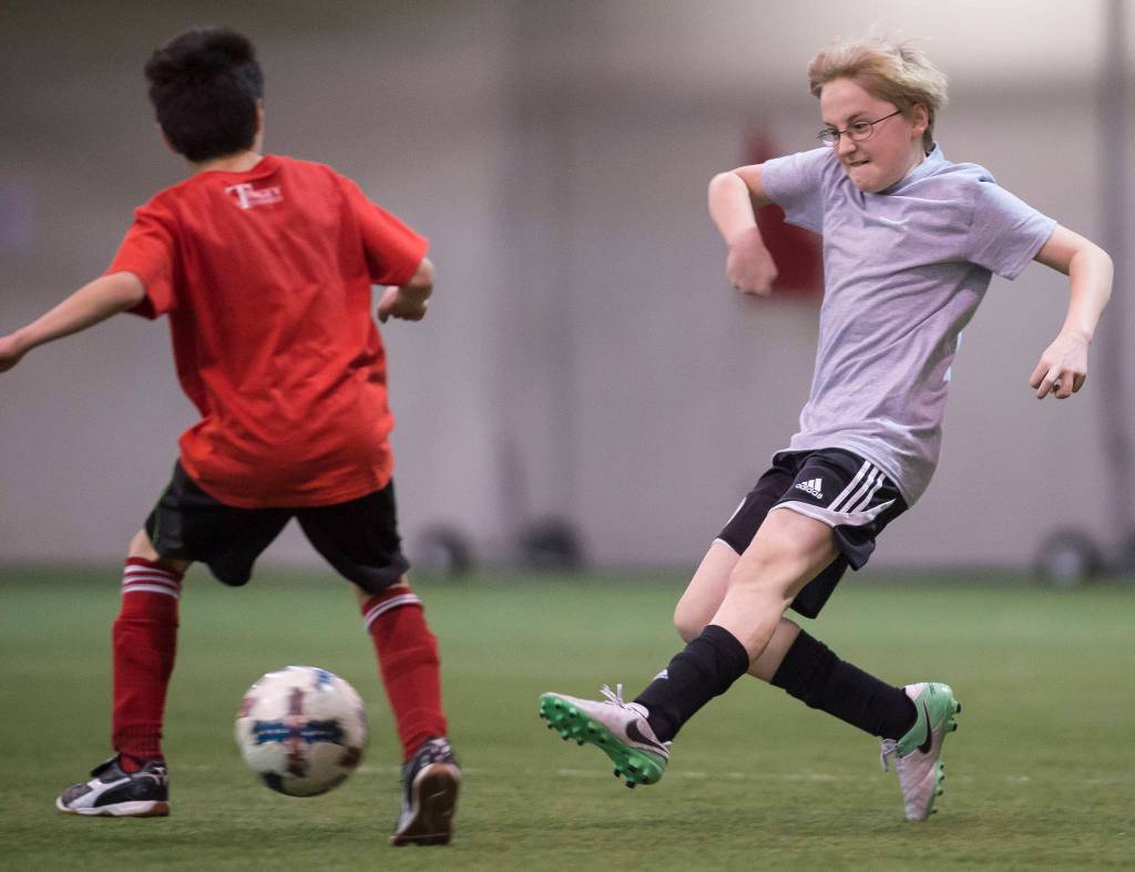 Missile Toes play against the Futbolistas at the Holiday Cup Soccer Tournament in the Dimond Park Field House on Friday, Dec. 22, 2017. The Holiday Cup is underway again now through New Years Eve with 400 players on 30 different teams. (Michael Penn | Juneau Empire File)