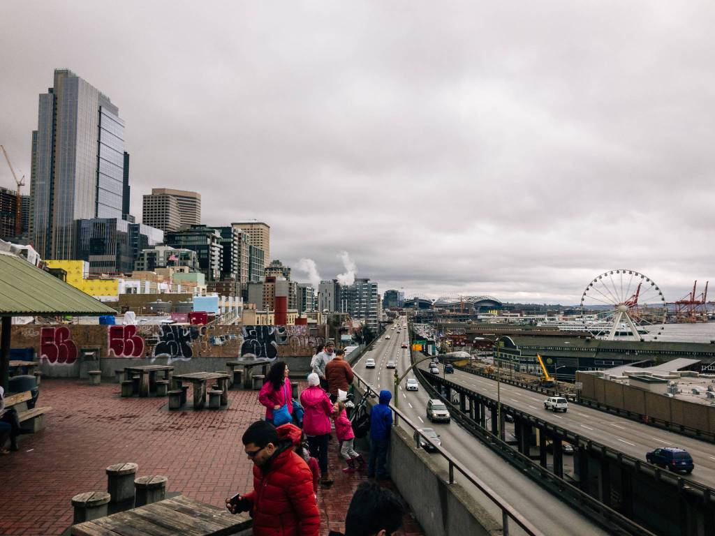 Tourists, Alaskan Way and the skyline of downtown Seattle from Pike Place. (Gabe Donohoe | For the Juneau Empire)