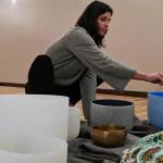 Lindsay Foreman, who lead a winter solstice sound bath at The Yoga Path, runs a foam wand around the rim of a singing bowl before the Dec. 21, 2018 event.