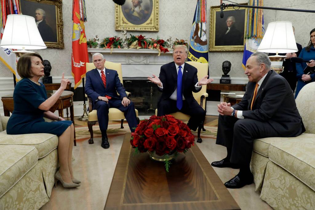 President Donald Trump and Vice President Mike Pence, second left, meet with Senate Minority Leader Chuck Schumer, D-N.Y., right, and House Minority Leader Nancy Pelosi, D-Calif., in the Oval Office of the White House on Tuesday, Dec. 11, 2018 in Washington, D.C. (Evan Vucci | Associated Press File)