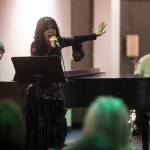 Juneau Cabaret singer Lynda Stover sings for Juneau residents as she is accompanied by Luke Weld and David Sheakley-Early during the third annual Holiday Extravaganza at Centennial Hall on Wednesday, Dec. 19, 2018. (Michael Penn | Juneau Empire)