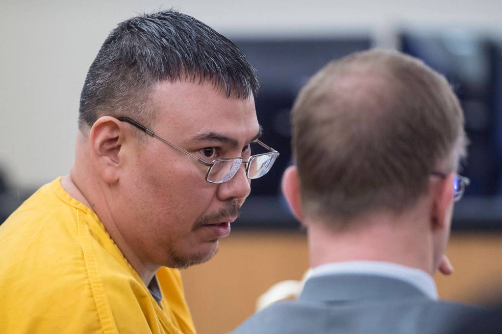 Thomas Jack, 42, speaks with his defense attorney Richard Payne during his sentencing in Juneau Superior Court for sexually abusing an 11-year-old girl placed in his and his wifes care in 2009. (Michael Penn | Juneau Empire)
