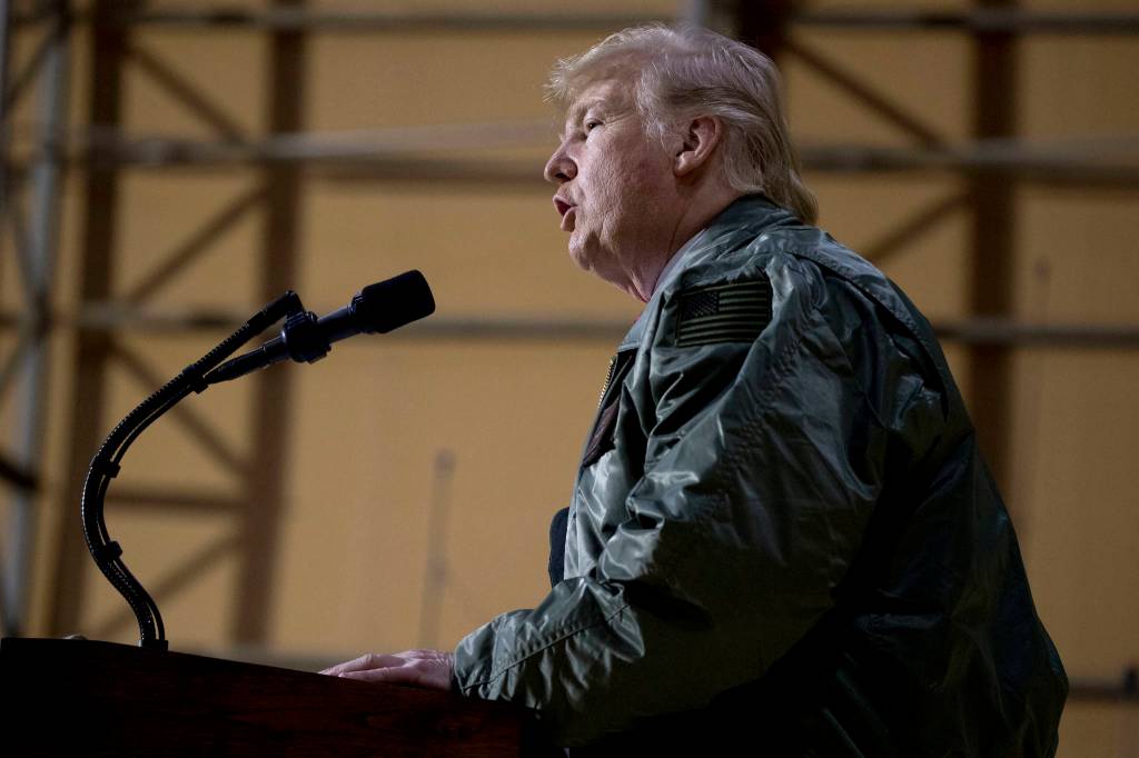 President Donald Trump speaks at a hanger rally at Al Asad Air Base, Iraq, Wednesday, Dec. 26, 2018. In a surprise trip to Iraq, President Donald Trump on Wednesday defended his decision to withdraw U.S. forces from Syria where they have been helping battle Islamic State militants. (Andrew Harnik | Associated Press)