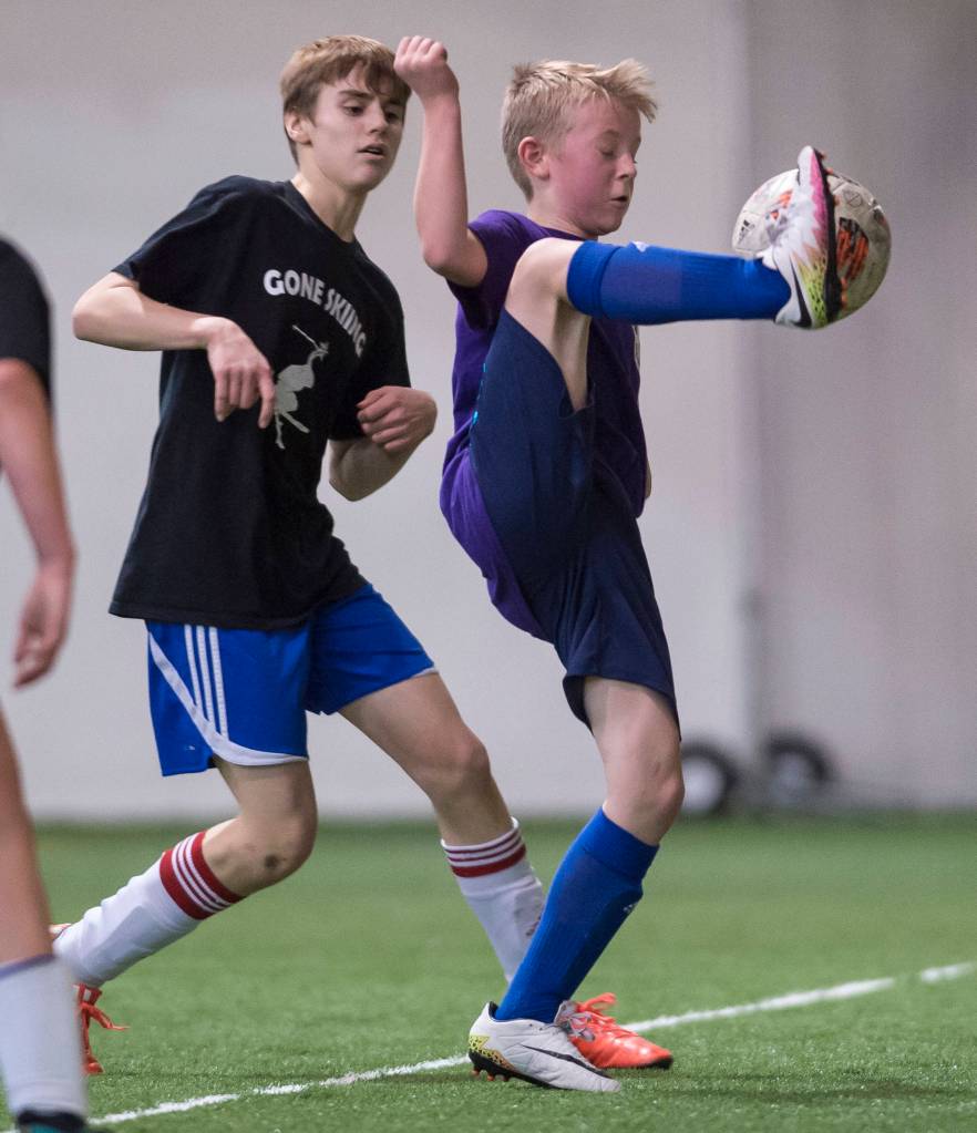 Grumpsicles play against Gone Skiing at the annual Holiday Cup Soccer Tournament at the Wells Fargo Dimond Park Field House on Wednesday, Dec. 26, 2018. (Michael Penn | Juneau Empire)