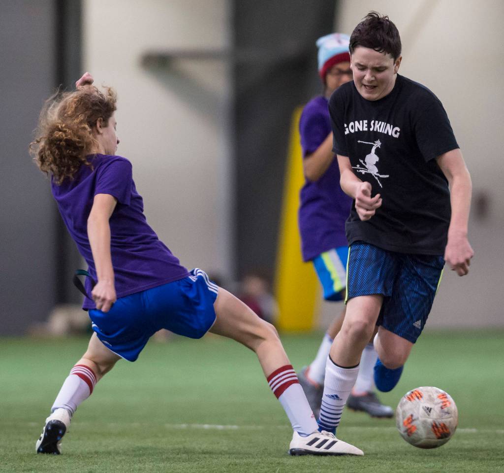 Grumpsicles play against Gone Skiing at the annual Holiday Cup Soccer Tournament at the Wells Fargo Dimond Park Field House on Wednesday, Dec. 26, 2018. (Michael Penn | Juneau Empire)