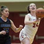 Easts Skye Miller passes the ball away from Barrows Jordan Ahgeak at the Princess Cruises Capital City Classic at Juneau-Douglas High School on Thursday, Dec. 27, 2018. East won 48-43. (Michael Penn | Juneau Empire)